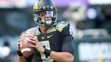 Nov 1, 2014; Eugene, OR, USA; Oregon Ducks quarterback Marcus Mariota (8) throws the ball before the game against the Stanford Cardinal at Autzen Stadium. Mandatory Credit: Scott Olmos-USA TODAY Sports