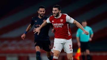 Arsenal's German-born Bosnian defender Sead Kolasinac (R) pulls away from Manchester City's Algerian midfielder Riyad Mahrez during the English League Cup quarter final football match between Arsenal and Manchester City at the Emirates Stadium, in London on December 22, 2020. (Photo by Adrian DENNIS / AFP) / RESTRICTED TO EDITORIAL USE. No use with unauthorized audio, video, data, fixture lists, club/league logos or 'live' services. Online in-match use limited to 120 images. An additional 40 images may be used in extra time. No video emulation. Social media in-match use limited to 120 images. An additional 40 images may be used in extra time. No use in betting publications, games or single club/league/player publications. / (Photo by ADRIAN DENNIS/AFP via Getty Images)