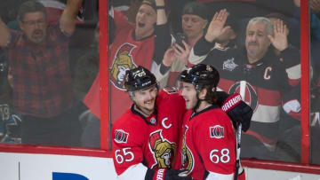 Dec 18, 2015; Ottawa, Ontario, CAN; The Ottawa Senators defenseman Erik Karlsson (65) celebrates with left wing Mike Hoffman (68) after scoring a goal in the third period against the San Jose Sharks at the Canadian Tire Centre. The Senators won 4-2. Mandatory Credit: Marc DesRosiers-USA TODAY Sports