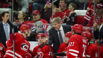 Dec 5, 2015; Raleigh, NC, USA; Carolina Hurricanes head coach Bill Peters talks to forward Joakim Nordstrom (42) during the 3rd period against the Montreal Canadiens at PNC Arena. The Carolina Hurricanes defeated the Montreal Canadiens 3-2. Mandatory Credit: James Guillory-USA TODAY Sports