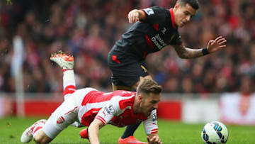 LONDON, ENGLAND - APRIL 04: Aaron Ramsey of Arsenal battles for the ball with Philippe Coutinho of Liverpool during the Barclays Premier League match between Arsenal and Liverpool at Emirates Stadium on April 4, 2015 in London, England. (Photo by Paul Gilham/Getty Images)