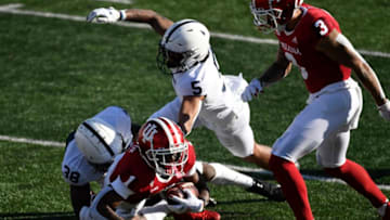 Oct 24, 2020; Bloomington, Indiana, USA; Indiana Hoosiers wide receiver Whop Philyor (1) is tackled by Penn State Nittany Lions safety Lamont Wade (38) and Penn State Nittany Lions cornerback Tariq Castro-Fields (5) during the second quarter of the game at Memorial Stadium. Mandatory Credit: Marc Lebryk-USA TODAY Sports