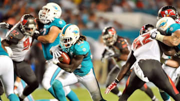 Sep 3, 2015; Miami Gardens, FL, USA; Miami Dolphins running back Jay Ajayi (33) runs against the Tampa Bay Buccaneers during the first half at Sun Life Stadium. Mandatory Credit: Steve Mitchell-USA TODAY Sports