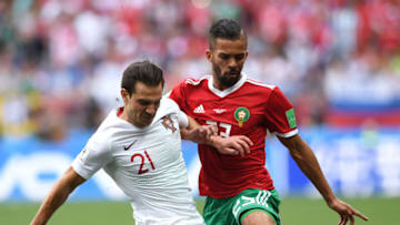 MOSCOW, RUSSIA - JUNE 20: Cedric of Portugal is challenged by Mehdi Carcela of Morocco during the 2018 FIFA World Cup Russia group B match between Portugal and Morocco at Luzhniki Stadium on June 20, 2018 in Moscow, Russia. (Photo by Stu Forster/Getty Images)