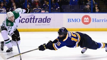 Nov 28, 2016; St. Louis, MO, USA; St. Louis Blues center Robby Fabbri (15) dives for the puck as Dallas Stars defenseman Esa Lindell (23) defends during the third period at Scottrade Center. The Blues won 4-3 in overtime. Mandatory Credit: Jeff Curry-USA TODAY Sports