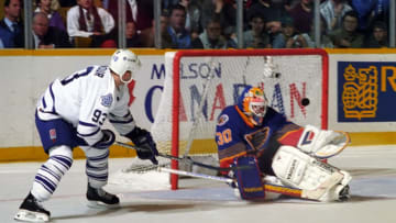 TORONTO, ON - APRIL 16: Jon Casey #30 of the St. Louis Blues skates against Doug Gilmour #93 of the Toronto Maple Leafs during the quarter finals of the1995-1996 NHL Playoffs at Maple Leaf Gardens in Toronto, Ontario, Canada. (Photo by Graig Abel/Getty Images)