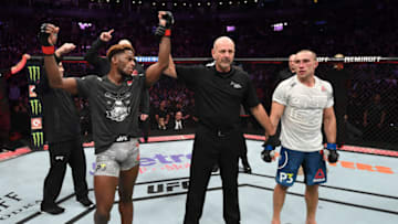 TORONTO, CANADA - DECEMBER 08: (L-R) Hakeem Dawodu of Canada celebrates his victory over Kyle Bochniak in their featherweight fight during the UFC 231 event at Scotiabank Arena on December 8, 2018 in Toronto, Canada. (Photo by Josh Hedges/Zuffa LLC/Zuffa LLC via Getty Images)