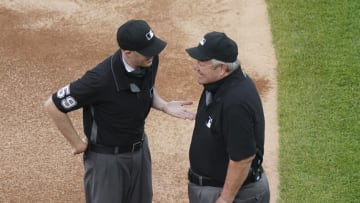CHICAGO, ILLINOIS - MAY 24: Umpire Nic Lentz #59 laughs with umpire Joe West #22 prior to a game between the Chicago White Sox and the St. Louis Cardinals at Guaranteed Rate Field on May 24, 2021 in Chicago, Illinois. (Photo by Nuccio DiNuzzo/Getty Images)