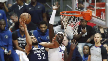 LOS ANGELES, CA - NOV 05: Karl-Anthony Towns #32 of the Minnesota Timberwolves shoots the ball against Montrezl Harrell #5 of the LA Clippers during a game on November 5, 2018 at the Staples Center in Los Angeles, California.NOTE TO USER: User expressly acknowledges and agrees that, by downloading and/or using this Photograph, user is consenting to the terms and conditions of the Getty Images License Agreement. Mandatory Copyright Notice: Copyright 2018 NBAE (Photo by Chris Elise/NBAE via Getty Images)