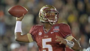 Jan 6, 2014; Pasadena, CA, USA; Florida State Seminoles quarterback Jameis Winston (5) passes the football against the Auburn Tigers during the first half of the 2014 BCS National Championship game at the Rose Bowl. Mandatory Credit: Kirby Lee-USA TODAY Sports