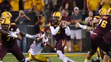 TEMPE, AZ - OCTOBER 28: Manny Wilkins #5 of Arizona State looks to throw the ball while avoiding a sack by Uchenna Nwosu #42 of Southern California during the first half at Sun Devil Stadium on October 28, 2017 in Tempe, Arizona. (Photo by Norm Hall/Getty Images)