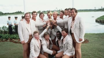 Jack Nicklaus, Captain of the United States team holds the Ryder Cup trophy with team members Fuzzy Zoeller, Jay Haas, Gil Morgan, Bob Gilder, Ben Crenshaw, Calvin Peete, Curtis Strange,Tom Kite, Craig Stadler, Lanny Wadkins, Raymond Floyd and Tom Watson during the 25th Ryder Cup Matches on 16 October 1983 at the PGA National Golf Club in Palm Beach Gardens, Florida. (Photo by Getty Images)