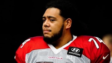 Jul 28, 2013; Glendale, AZ, USA; Arizona Cardinals offensive tackle Paul Fanaika (74) looks on during training camp at University of Phoenix Stadium. Mandatory Credit: Matt Kartozian-USA TODAY Sports