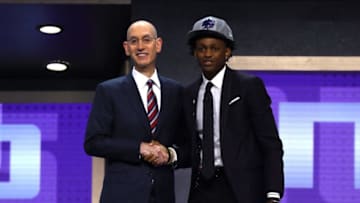 NEW YORK, NY - JUNE 22: DeAaron Fox walks on stage with NBA commissioner Adam Silver after being drafted fifth overall by the Sacramento Kings during the first round of the 2017 NBA Draft at Barclays Center on June 22, 2017 in New York City. NOTE TO USER: User expressly acknowledges and agrees that, by downloading and or using this photograph, User is consenting to the terms and conditions of the Getty Images License Agreement. (Photo by Mike Stobe/Getty Images)
