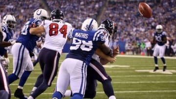 Dec 15, 2013; Indianapolis, IN, USA; Indianapolis Colts linebacker Robert Mathis (98) sacks Houston Texans quarterback Case Keenum (7) causing a fumble that results in a safety at Lucas Oil Stadium. Indianapolis defeats Houston 25-3. Mandatory Credit: Brian Spurlock-USA TODAY Sports