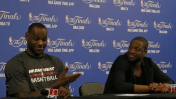 Jun 10, 2014; Miami, FL, USA; Miami Heat forward LeBron James and guard Dwyane Wade answer questions at a post-game press conference after game three against the San Antonio Spurs of the 2014 NBA Finals at American Airlines Arena. San Antonio defeated Miami 111-92. Mandatory Credit: Robert Mayer-USA TODAY Sports