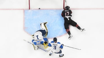 EDMONTON, AB - AUGUST 15: Ridly Greig #17 of Canada skates scores a goal on Leevi Meriläinen #1 of Finland in the IIHF World Junior Championship on August 15, 2022 at Rogers Place in Edmonton, Alberta, Canada (Photo by Andy Devlin/ Getty Images)
