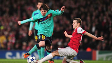 LONDON, ENGLAND - FEBRUARY 16: Lionel Messi of Barcelona is challenged by Jack Wilshere of Arsenal during the UEFA Champions League round of 16 first leg match between Arsenal and Barcelona at the Emirates Stadium on February 16, 2011 in London, England. (Photo by Shaun Botterill/Getty Images)