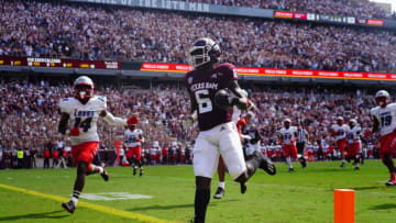 COLLEGE STATION, TX - SEPTEMBER 18: Running back Devon Achane #6 of the Texas A&M Aggies scores a touchdown in the first quarter against the New Mexico Lobos at Kyle Field on September 18, 2021 in College Station, Texas. (Photo by Alex Bierens de Haan/Getty Images)
