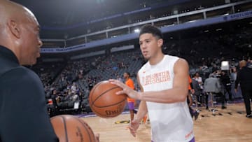 SACRAMENTO, CA - MARCH 23: Devin Booker #1 of the Phoenix Suns inspects a basketball prior to the game against the Sacramento Kings on March 23, 2019 at Golden 1 Center in Sacramento, California. NOTE TO USER: User expressly acknowledges and agrees that, by downloading and or using this photograph, User is consenting to the terms and conditions of the Getty Images Agreement. Mandatory Copyright Notice: Copyright 2019 NBAE (Photo by Rocky Widner/NBAE via Getty Images)