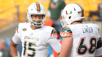 Nov 27, 2015; Pittsburgh, PA, USA;Nick Linder anchors an offensive that needs perform better protecting Brad Kaaya and sparking the running game this season.Miami Hurricanes quarterback Brad Kaaya (15) talks with center Nick Linder (68) before playing the Pittsburgh Panthers at Heinz Field. Miami won 29-24. Mandatory Credit: Charles LeClaire-USA TODAY Sports