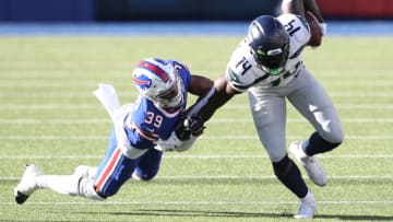 ORCHARD PARK, NEW YORK - NOVEMBER 08: Levi Wallace #39 of the Buffalo Bills tackles DK Metcalf #14 of the Seattle Seahawks during the first half at Bills Stadium on November 08, 2020 in Orchard Park, New York. (Photo by Bryan M. Bennett/Getty Images)