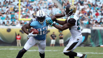 JACKSONVILLE, FL - SEPTEMBER 17: Delanie Walker #82 of the Tennessee Titans runs with the football against Telvin Smith #50 of the Jacksonville Jaguars during the second half of their game at EverBank Field on September 17, 2017 in Jacksonville, Florida. (Photo by Sam Greenwood/Getty Images)