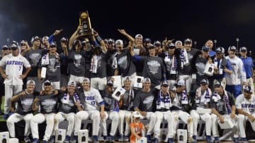 Jun 27, 2017; Omaha, NE, USA; Florida Gators players and coaches celebrate with the national championship trophy after the game against the LSU Tigers in game two of the championship series of the 2017 College World Series at TD Ameritrade Park Omaha. Mandatory Credit: Steven Branscombe-USA TODAY Sports