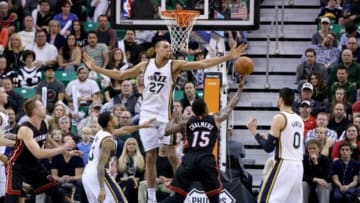 Dec 12, 2014; Salt Lake City, UT, USA; Utah Jazz center Rudy Gobert (27) tries to block the shot of Miami Heat guard Mario Chalmers (15) during the fourth quarter at EnergySolutions Arena. Miami Heat won the game 100-95. Mandatory Credit: Chris Nicoll-USA TODAY Sports