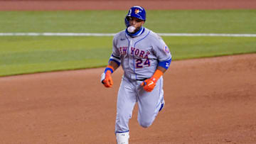 MIAMI, FLORIDA - AUGUST 17: Robinson Cano #24 of the New York Mets runs the bases on his second home run of the game in the sixth inning against the Miami Marlins at Marlins Park on August 17, 2020 in Miami, Florida. (Photo by Mark Brown/Getty Images)