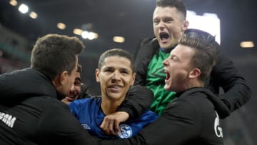 03 November 2019, Bavaria, Augsburg: Soccer: Bundesliga, FC Augsburg - FC Schalke 04, 10th matchday in the WWK-Arena. Schalke's Amine Harit (M) is acclaimed. Photo: Stefan Puchner/dpa - IMPORTANT NOTE: In accordance with the requirements of the DFL Deutsche Fußball Liga or the DFB Deutscher Fußball-Bund, it is prohibited to use or have used photographs taken in the stadium and/or the match in the form of sequence images and/or video-like photo sequences. (Photo by Stefan Puchner/picture alliance via Getty Images)
