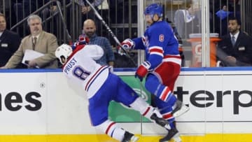 May 22, 2014; New York, NY, USA; Montreal Canadiens right wing Brandon Prust (left) is knocked down by New York Rangers defenseman Kevin Klein during the third period in game three of the Eastern Conference Final of the 2014 Stanley Cup Playoffs at Madison Square Garden. Mandatory Credit: Andy Marlin-USA TODAY Sports
