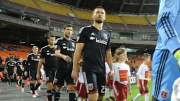 Oct 28, 2015; Washington, DC, USA; Kids escort D.C. United midfielder/defender Perry Kitchen (23) on to the field before the game between the D.C. United and the New England Revolution at Robert F. Kennedy Memorial. D.C. United won 2-1. Mandatory Credit: Brad Mills-USA TODAY Sports