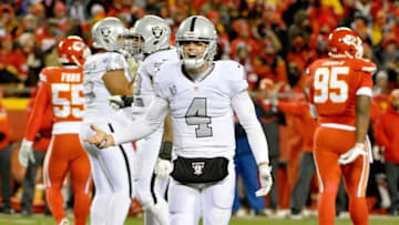 Dec 8, 2016; Kansas City, MO, USA; Oakland Raiders quarterback Derek Carr (4) looks for a penalty during the second half against the Kansas City Chiefs at Arrowhead Stadium. The Chiefs won 21-13. Mandatory Credit: Denny Medley-USA TODAY Sports