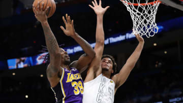 Dec 10, 2021; Oklahoma City, Oklahoma, USA; Los Angeles Lakers center Dwight Howard (39) goes to the basket as Oklahoma City Thunder forward Jeremiah Robinson-Earl (50) defends during the first quarter at Paycom Center. Mandatory Credit: Alonzo Adams-USA TODAY Sports