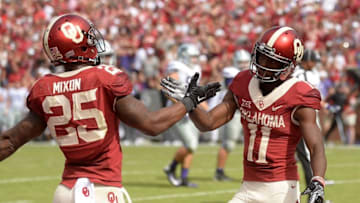 Oct 15, 2016; Norman, OK, USA; Oklahoma Sooners wide receiver Dede Westbrook (11) and Oklahoma Sooners running back Joe Mixon (25) celebrate a touchdown against the Kansas State Wildcats during the third quarter at Gaylord Family - Oklahoma Memorial Stadium. Mandatory Credit: Mark D. Smith-USA TODAY Sports