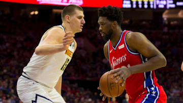 Joel Embiid #21 of the Philadelphia 76ers controls the ball against Nikola Jokic #15 of the Denver Nuggets at the Wells Fargo Center on 8 Feb. 2019 in Philadelphia, Pennsylvania. The 76ers defeated the Nuggets 117-110. (Photo by Mitchell Leff/Getty Images)