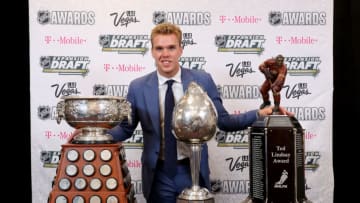 LAS VEGAS, NV - JUNE 21: Connor McDavid of the Edmonton Oilers poses with the Art Ross Trophy, Hart Memorial Trophy and the Ted Lindsay Award after the 2017 NHL Awards and Expansion Draft at T-Mobile Arena on June 21, 2017 in Las Vegas, Nevada. (Photo by Bruce Bennett/Getty Images)