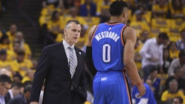 May 16, 2016; Oakland, CA, USA; Oklahoma City Thunder head coach Billy Donovan (left) instructs guard Russell Westbrook (0) against the Golden State Warriors during the first quarter in game one of the Western conference finals of the NBA Playoffs at Oracle Arena. Mandatory Credit: Kyle Terada-USA TODAY Sports