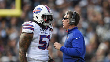 December 21, 2014; Oakland, CA, USA; Buffalo Bills defensive coordinator Jim Schwartz (right) instructs middle linebacker Brandon Spikes (51) during the third quarter against the Oakland Raiders at O.co Coliseum. The Raiders defeated the Bills 26-24. Mandatory Credit: Kyle Terada-USA TODAY Sports