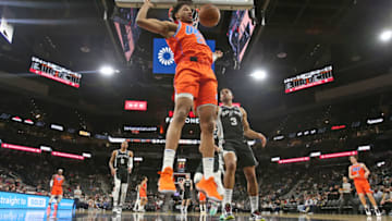 Aaron Wiggins #21 of the Oklahoma City Thunder dunks against the San Antonio Spurs in the second half at AT&T Center on January 19, 2022 in San Antonio,Texas. NOTE TO USER: User expressly acknowledges and agrees that, by downloading and or using this photograph, User is consenting to terms and conditions of the Getty Images License Agreement. (Photo by Ronald Cortes/Getty Images)