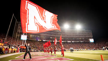 LINCOLN, NE - OCTOBER 27: A member of the Nebraska Cornhuskers cheer squad waves a flag after a touchdown during their game against the Michigan Wolverines at Memorial Stadium on October 27, 2012 in Lincoln, Nebraska. Nebraska beat Michigan 23-9. (Photo by Eric Francis/Getty Images)