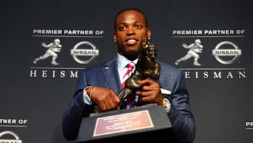 Dec 12, 2015; New York, NY, USA; Alabama running back Derrick Henry poses with the Heisman Trophy during a press conference at the New York Marriott Marquis after winning the trophy during the 81st annual Heisman Trophy presentation. Mandatory Credit: Brad Penner-USA TODAY Sports