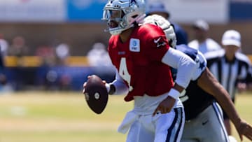Aug 2, 2022; Oxnard, CA, USA; Dallas Cowboys quarterback Dak Prescott (4) scrambles during training camp at River Ridge Playing Fields in Oxnard, California. Mandatory Credit: Jason Parkhurst-USA TODAY Sports