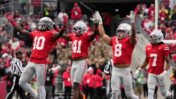 Oct. 7, 2023; Columbus, Oh., USA;Ohio State Buckeyes safety Lathan Ransom (8) celebrates with Ohio State Buckeyes cornerback Denzel Burke (10) and Ohio State Buckeyes safety Josh Proctor (41) after intercepting off a pass during the second half of Saturday's NCAA Division I football game against the Maryland Terrapins at Ohio Stadium.