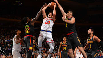 NEW YORK, NY - DECEMBER 10: Doug McDermott #20 of the New York Knicks shoots the ball in traffic against the Atlanta Hawks at Madison Square Garden on December 10, 2017 in New York, New York. Copyright 2017 NBAE (Photo by Jesse D. Garrabrant/NBAE via Getty Images)