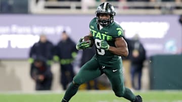 EAST LANSING, MICHIGAN - NOVEMBER 13: Kenneth Walker III #9 of the Michigan State Spartans runs up the field against the Maryland Terrapins in the first half at Spartan Stadium on November 13, 2021 in East Lansing, Michigan. (Photo by Mike Mulholland/Getty Images)