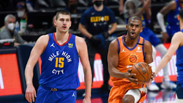Chris Paul #3 of the Phoenix Suns has the ball against Nikola Jokic #15 of the Denver Nuggets in Game Three of the Western Conference second-round playoff series at Ball Arena on 11 Jun. 2021 in Denver, Colorado. (Photo by Dustin Bradford/Getty Images)