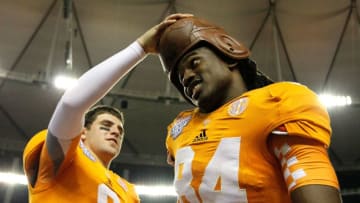 ATLANTA, GA - AUGUST 31: Tyler Bray #8 of the Tennessee Volunteers puts the leather helmet on Cordarrelle Patterson #84 after their 35-21 win over the North Carolina State Wolfpack at Georgia Dome on August 31, 2012 in Atlanta, Georgia. (Photo by Kevin C. Cox/Getty Images)
