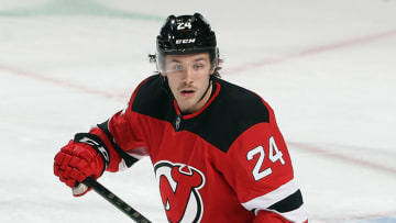 NEWARK, NEW JERSEY - JANUARY 24: Ty Smith #24 of the New Jersey Devils skates against the New York Islanders at the Prudential Center on January 24, 2021 in Newark, New Jersey. (Photo by Bruce Bennett/Getty Images)